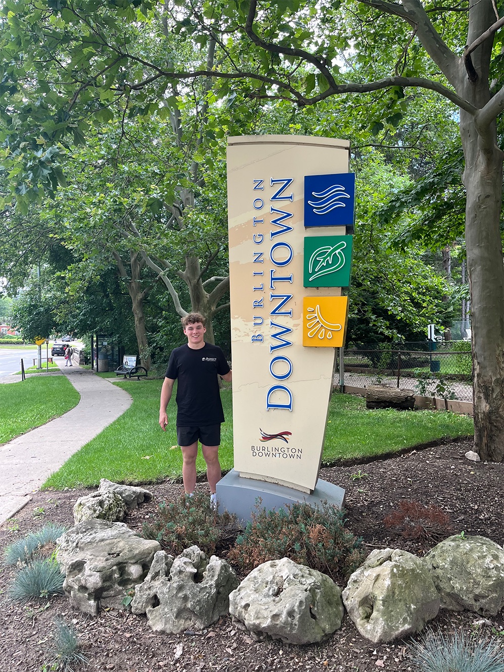 Aspect founder at the Burlington welcome sign